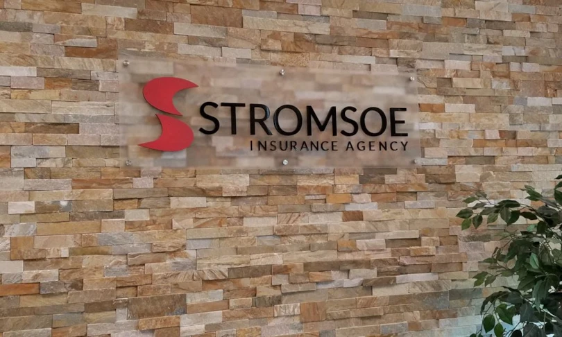 Acrylic Standoff Sign for Insurance Agency on Brick Wall