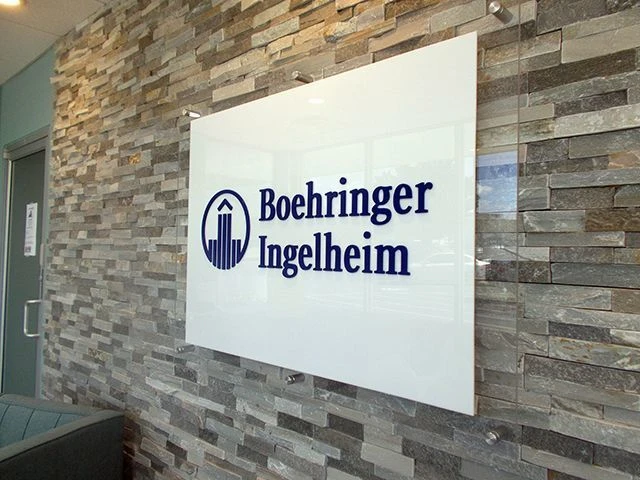 Interior Reception Acrylic Sign with Standoffs on Stone Background