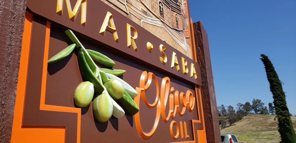 Routed sandblasted sign for olive oil company