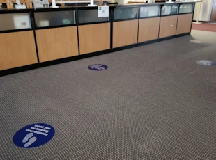 Social DIstancing Floor Graphics in School Reception Area