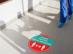 Social Distancing Graphics in Corridor