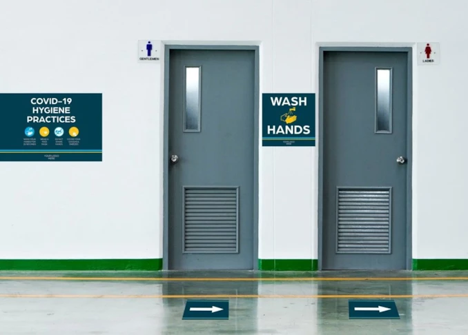 Health and Hygiene Signs Near Restrooms