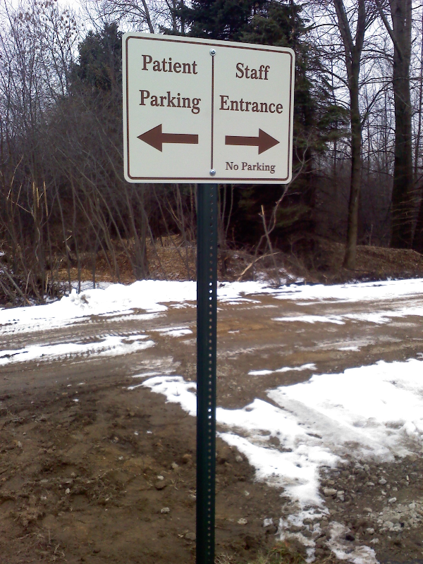 Digital printed vinyl w/ lamination on aluminum attached to a metal post