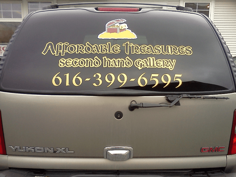Digital printed vinyl with lamination and cut vinyl on a vehicle.