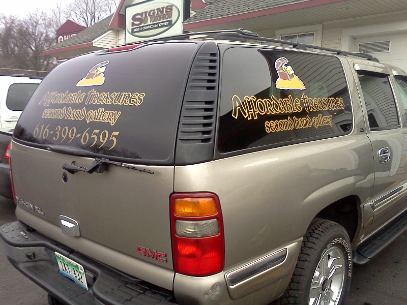 Digital printed vinyl with lamination and cut vinyl on a vehicle.