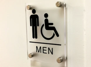 Custom ADA sign with braille for CARR Properties in Washington, DC.