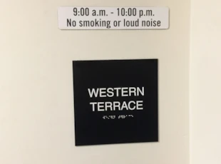 Custom ADA sign with braille for Cityline at Tenley in Washington, DC.