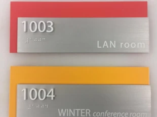 Custom ADA sign with acrylic and aluminum for Choice Hotels in Rockville, MD.
