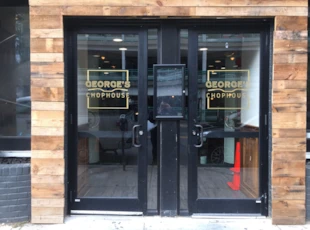 Gold vinyl logos on exterior doors for George's Chophouse in Bethesda, MD 