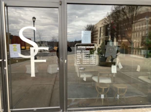 Custom cut window graphics business logo and store hours