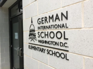 custom 3d logo sign mounted on brick wall
