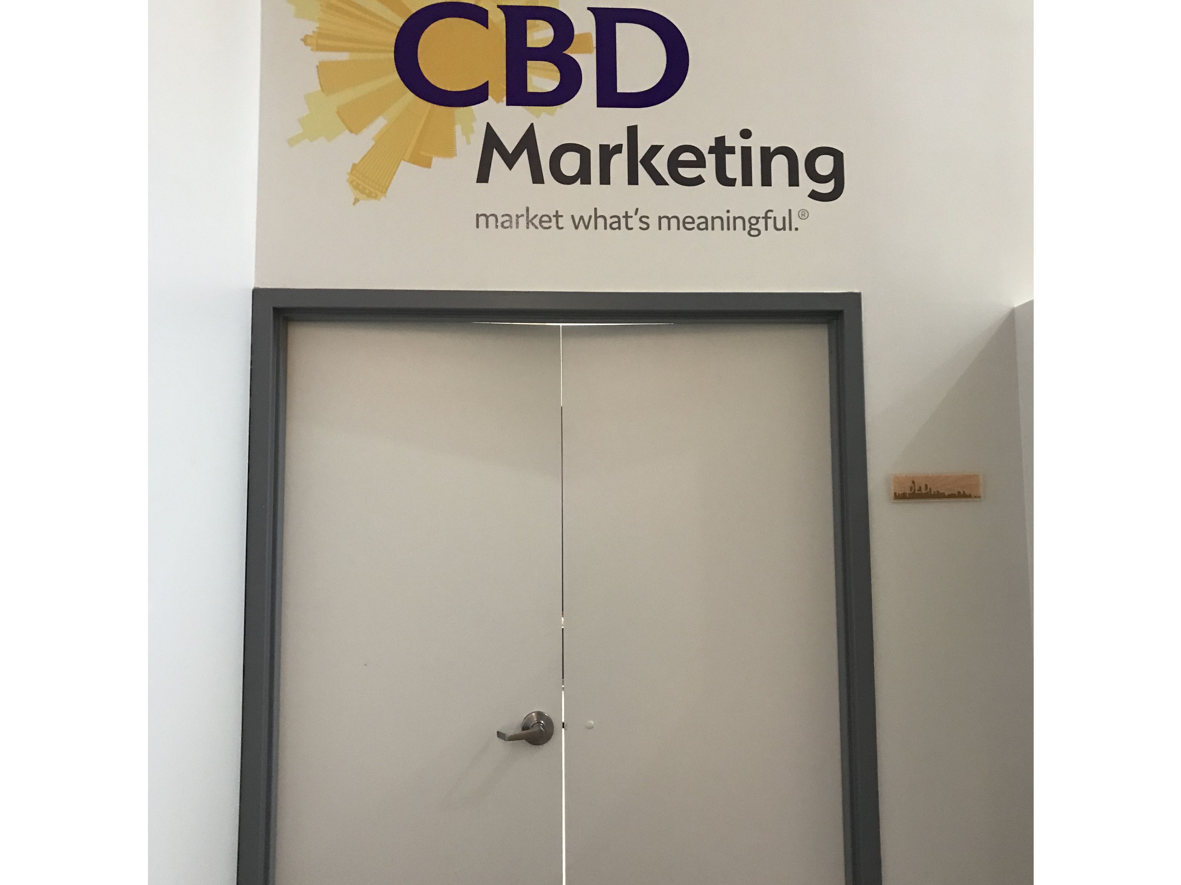 Custom logo cut to shape wall graphic at CBD Marketing in the  Chicago Loop