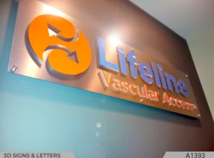 3D-Logo & Lettering with printed Faces on half inch thick clear Acrylic with Brushed Aluminum Panel and installed with Decorative Stand-offs.