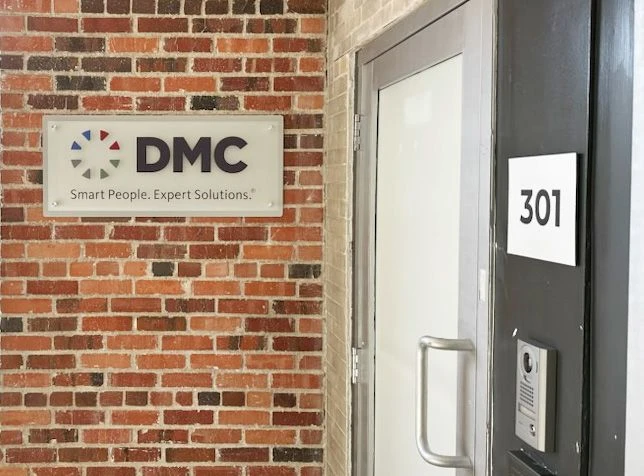 Acrylic stand-off sign on brick wall