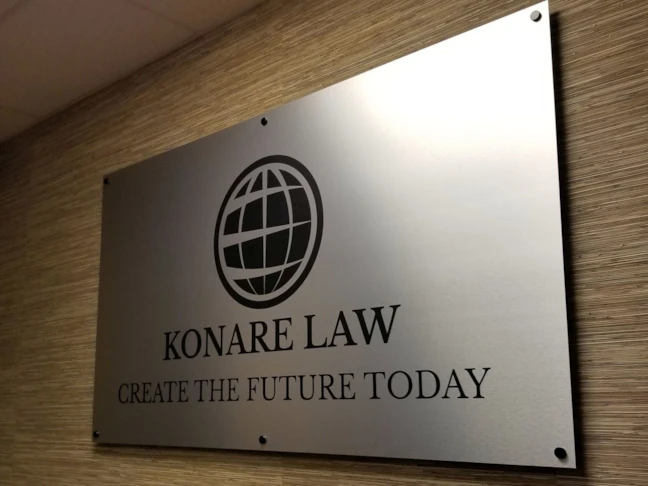 Brushed aluminum sign with black imprint & standoffs