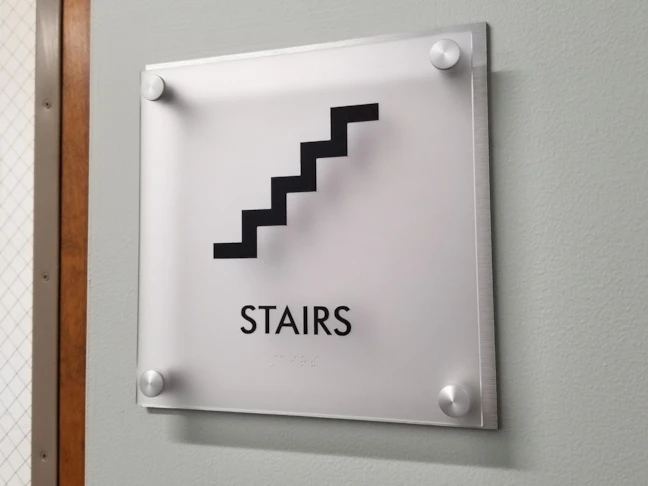Custom Frosted Acrylic and Brushed Silver ADA Signs