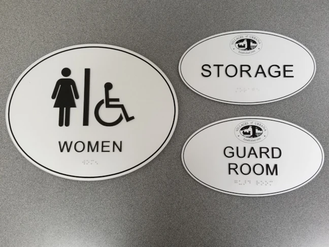 Custom Oval ADA Signs with Engraved Logos & Borders