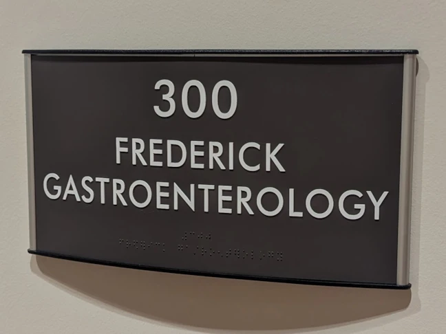 ADA Suite Sign with Curved Frame